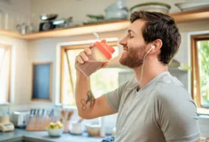 Someone enjoying a freshly made protein shake.